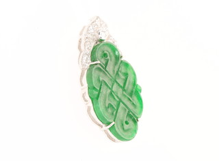 An 18ct white gold diamond and jade pendant 25mm x 12mm 
