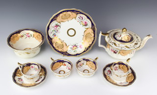 A Victorian tea and coffee service with floral decoration - 6 coffee cups (1 cracked), 9 tea cups (1 cracked), 9 saucers (2 cracked), 1 slop bowl (cracked), 1 plate, teapot and lid (cracked), a sucrier and lid (missing 1 handle) and a milk jug  