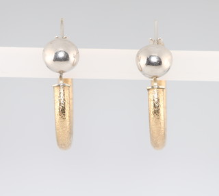 A pair of 9ct yellow gold earrings, 2.2 grams