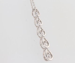 An 18ct white gold five stone diamond drop pendant and chain 