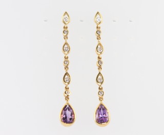 A pair of 18ct yellow gold amethyst and diamond earrings 34mm 