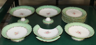 A 15 piece 19th Century dessert service comprising 2 large comports, 3 squat comports and 10 dessert plates with green and gilt banding and floral decoration to the centre, the base with impressed hand mark 