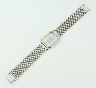 A gentleman's steel cased wrist watch set with a 1 gram platinum ingot