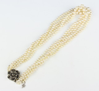 A cultured pearl multi strand necklace with a marcasite clasp 