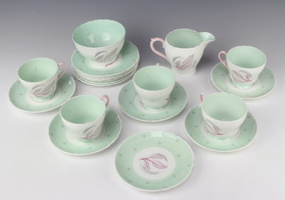 A Shelley Rhythm pattern tea set comprising 5 tea cups, 6 saucers, milk jug, sugar bowl and 6 small plates