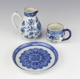 An 18th Century Chinese blue and white cream jug decorated with flowers 11cm (handle chipped), a ditto cup with floral decoration and a transfer print saucer