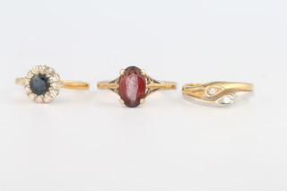 An 18ct yellow gold sapphire and diamond cluster ring size K 1/2, a ditto 2 colour 2 stone diamond ring size K 1/2 and a 9ct yellow gold garnet ring size P 