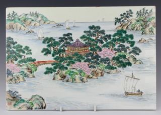 A Chinese 20th Century painted porcelain panel depicting boats off a coast with pagoda, signed 25cm x 36.5cm 