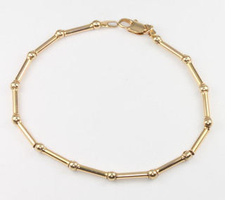 A 9ct yellow gold bar and ball bracelet, 4.1 grams, 18cm 