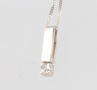 A 9ct white gold diamond set pendant and chain 10mm