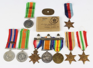 A First World War trio of medals to 3077 Pte.E.A.Barton Middlesex Regt. comprising 1914-15 Star, British War medal and Victory medal, together with a Second World War group comprising  two Defence medals, War medal with MID oak leaf cluster emblem, 1939-45 Star, Italy and Africa Stars, with posting box and an oval bronze Chinese token 