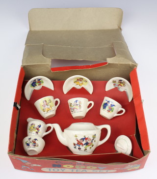 A child's Enid Blyton Noddy tea set comprising tea pot, milk jug, sugar bowl, 3 tea cups and 3 saucers, in original box 
