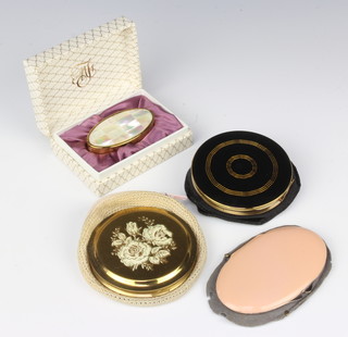 A vintage lipstick holder and 3 compacts 