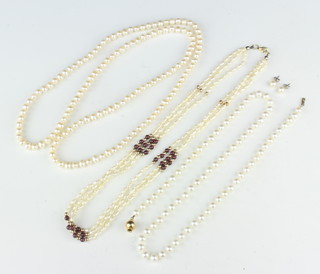 A string of cultured pearls with a 9ct clasp 53cm, two other pearl necklaces and a pair of ear studs 
