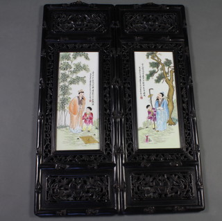 A pair of 20th Century Chinese painted porcelain panels with a figure with child beneath script contained in hardwood frames 88cm x 31cm 