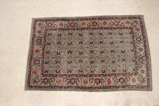 A blue ground Tabriz rug with central field within a multi row border 208cm x 136cm 