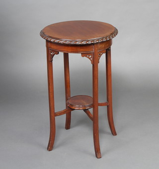 An Edwardian circular Chippendale style mahogany occasional table with gadrooned border, raised on square tapered supports with X framed stretcher 68cm x 43cm 