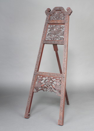 A Chinese pierced and carved hardwood easel 146cm x 48cm x 80cm 