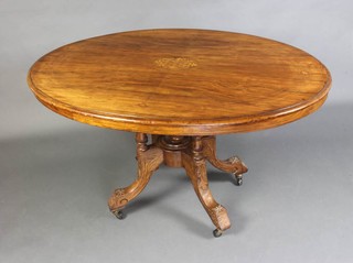 A Victorian oval inlaid walnut Loo table with quarter veneered top, raised on 4 turned columns 75cm h x 131cm l x 99cm d 