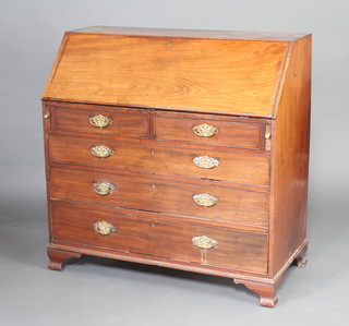 A George III mahogany bureau, the fall front revealing a well fitted interior with drawers and pigeon holes, with replacement swan neck drop handles, fitted 3 short and 3 long graduated drawers raised on bracket feet 109cm h x 110cm w x 53cm d 