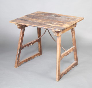 A 17th/18th Century rectangular Spanish hardwood folding trestle table with iron brackets, raised on square tapering supports 74cm h x 82cm l x 71cm w 
