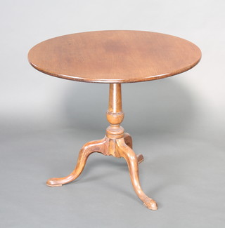A circular bleached mahogany tea table, raised on a turned column and tripod base 71cm h x 84cm diam. 