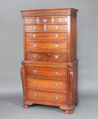A Georgian style mahogany chest on chest with moulded cornice and blind fret work frieze, the upper section fitted 4 short and 3 long drawers, the base fitted a brushing slide above 3 long drawers, raised on ogee bracket feet 180cm h x 95cm w x 46cm d 