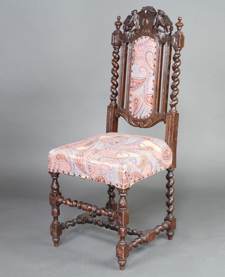 A Victorian carved oak Carolean high back chair, the seat and back upholstered in William Morris style material, raised on spiral turned and block supports 