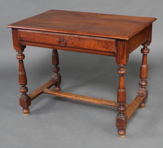 An 18th Century Continental fruitwood side table fitted 1 long drawer, raised on turned and block supports with H framed stretcher 72cm h x 91cm w x 59cm d 