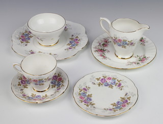 A Staffordshire Royal Sutherland part tea set comprising 6 tea cups, milk jug, sugar bowl, 6 saucers, 6 small plates, 1 medium plate and a cake plate 