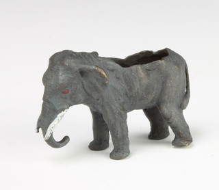 A bronze pin cushion in the form of an elephant 5cm x 7cm x 2cm 