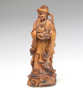 A Chinese carved hardwood figure of a standing sage 29cm x 10cm x 9cm