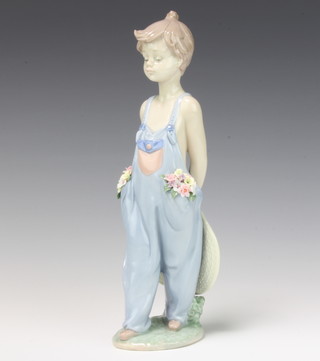 A Lladro figure of a young girl wearing dungarees with flowers in her pocket for the Collectors Society 1997 no.7650 24cm, boxed 