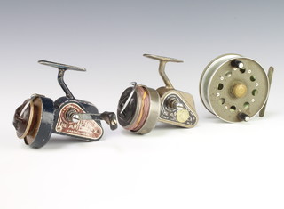 Two early J W Young ambidex fishing reels and a Strike Right centre pin reel, boxed
