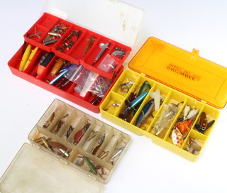Four fishing lure boxes containing vintage flies, Wadhams lures, Hardy, Millwells, Allcocks and others 