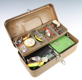 A metal cantilever tackle box containing a Rody 300 centre pin fishing reel (f), various lures and floats etc 