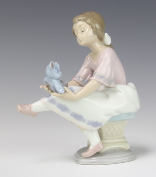 A Lladro figure of a girl with a teddy in her lap for The Collector's Society 1993 no.7620 16cm, boxed  