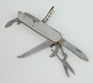 An eleven bladed folding knife with tin opener, corkscrew, etc, the blade marked Stainless