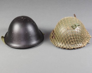 Two 1950's steel helmets complete with liners 