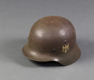 A child's German M35 steel helmet complete with leather liner marked Schuberth-Werkerg Braunschvie 60-53, the side of the helmet impressed NS60 
