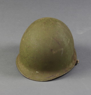 An American M1 steel helmet complete with liner 