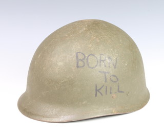 An American M1 style steel helmet complete with leather liner (slight dent to top) 