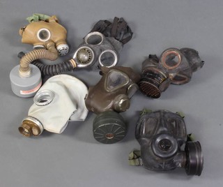 A Second World War civil defence respirator, ditto military respirator (f) and 4 other later respirators 