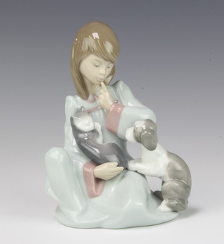 A Lladro figure of a girl in a nightdress with a kitten and puppy no.5640 14cm 