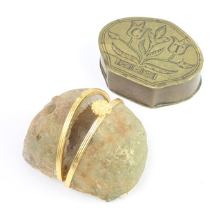 A Dutch style brass snuff box with hinged lid decorated tulips and marked CT264 together with a trinket box formed from a stone with gilt metal mounts