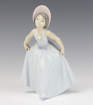 A Lladro figure of a lady holding up her skirt no.6274 19cm 