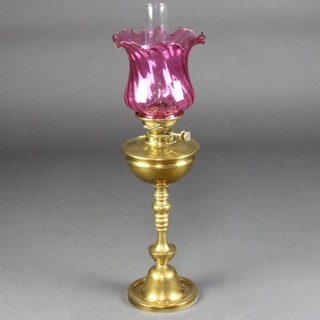 A brass oil lamp with glass shade and clear glass chimney 70cm x 18cm 