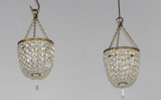 A pair of circular bag shaped light fittings hung lozenges 20cm x 15cm 