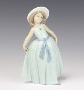 A Lladro figure of a girl holding her skirt no.6275 18cm
