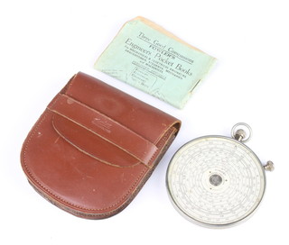 A Flowers Universal calculator complete with instructions and leather pouch 